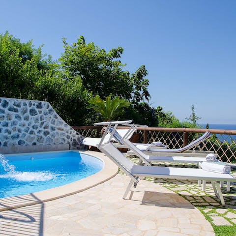 Soak up the sun by the pool overlooking the waves