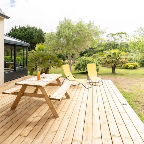 Sit out on your sunny deck and enjoy an afternoon snooze in the lounge chairs