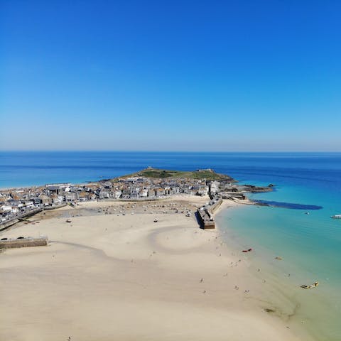 Treat yourself to a day of sun, surf, and sand at Porthminster Beach, a ten-minute walk from home