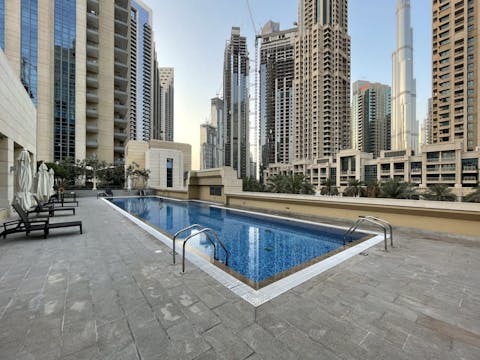 Enjoy a refreshing dip in the communal pool as the Dubai sun shines down