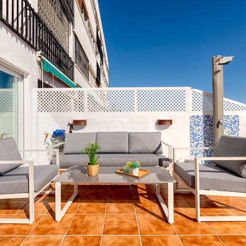 Mix up cocktails or Spanish sangria and watch the sunset on the private terrace