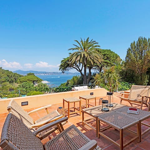 Sip cocktails while drinking in panoramic sea views