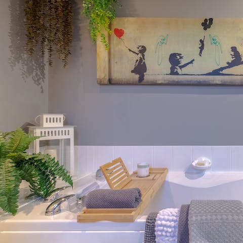Have a restorative soak in the bathtub surrounded by street art and house plants