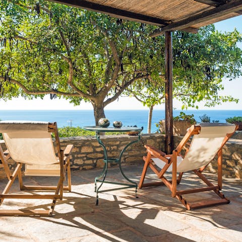 Take in stunning views over the bay of Paleopoli from the veranda 