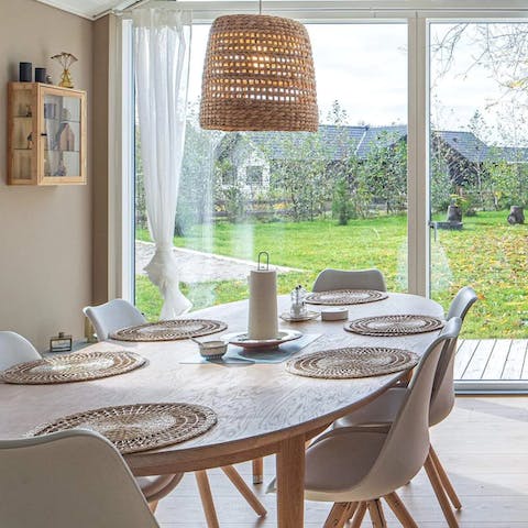 Enjoy home-cooked meals at the bright dining table