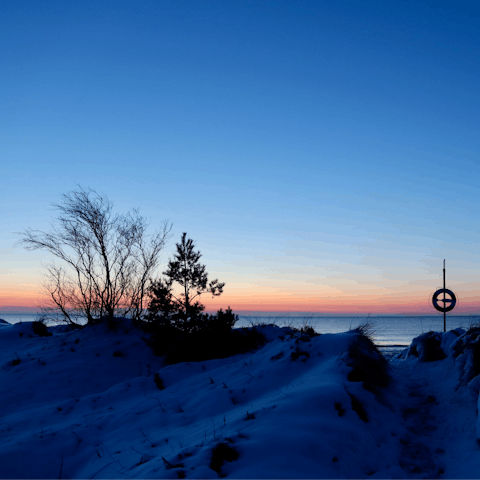 Watch sunsets at Marielyst's Bøtø Strand, just six minutes away by car
