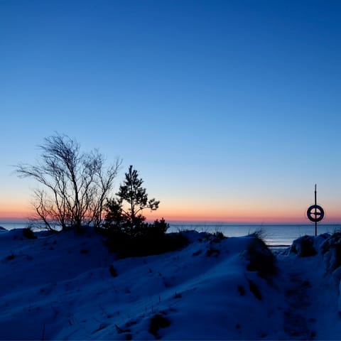 Watch sunsets at Marielyst's Bøtø Strand, just six minutes away by car