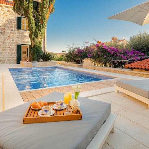 Tuck into an alfresco breakfast with coffee by the plunge pool, perfect for sunny mornings