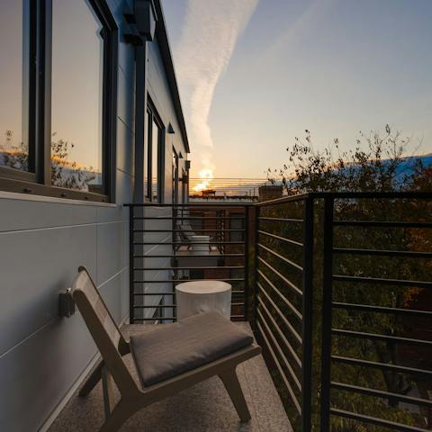 Watch the sunset from your private balcony, a glass of wine in hand