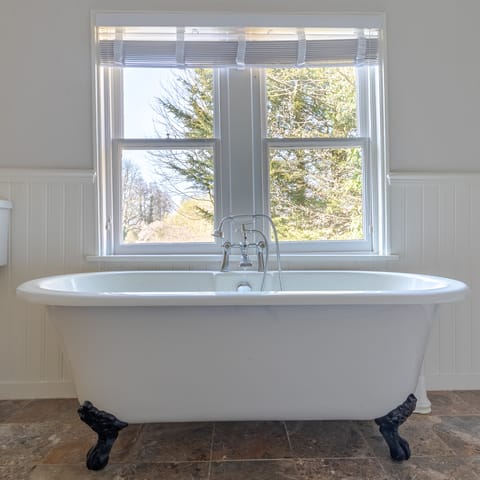Soak in the elegant free-standing bathtub