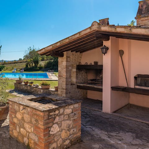 Fire up the brick barbecue or wood oven and whip up a feast in the outdoor kitchen