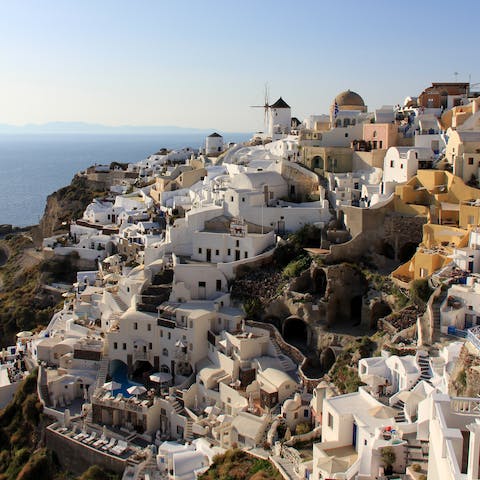 Make the thirty-minute drive to the coastal town of Oia
