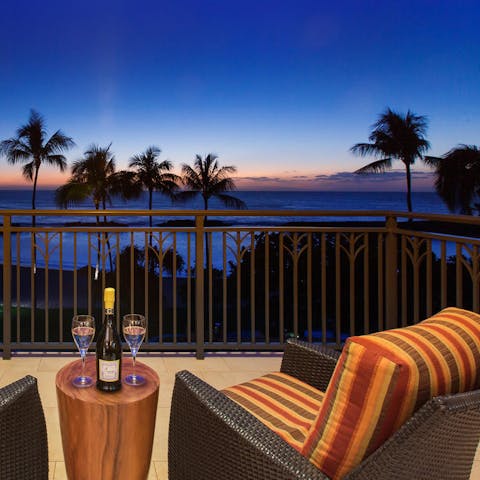 End the evening with a drink on the private balcony, watching the sunset over the ocean