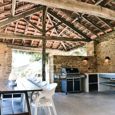 Cook up a feast in the outdoor kitchen to enjoy alfresco