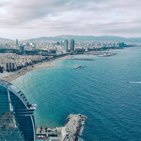 Jump on the bus and head to Barceloneta Beach – only thirty–minutes away