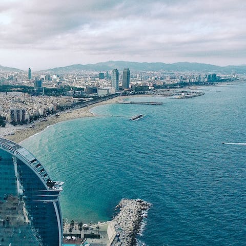 Jump on the bus and head to Barceloneta Beach – only thirty–minutes away