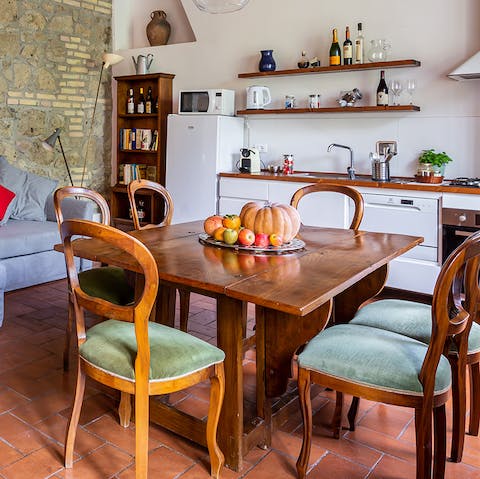 Share carbonara and a bottle of Barolo wine on the rustic dining table