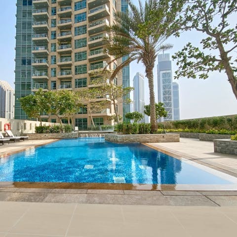 Take a refreshing dip in the communal pool as the breeze rustles through the palm trees