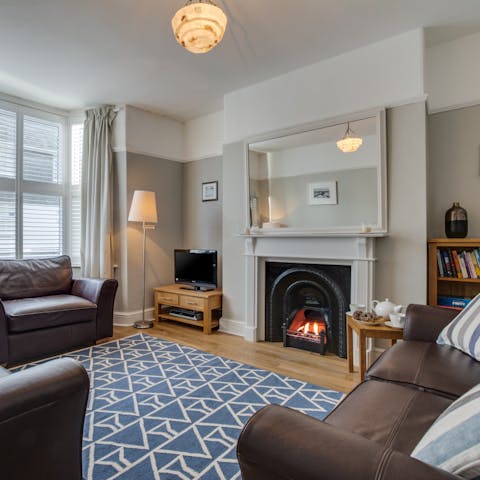 Cosy up by the original fireplace with a good book