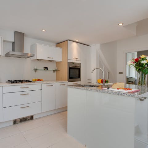 Whip up those avocado toast breakfasts in the sleek island kitchen