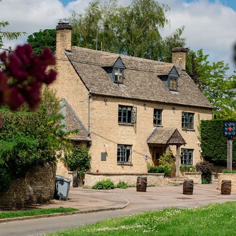 Nip across to The Chequers for an ice-cold drink and hearty serving of pub grub