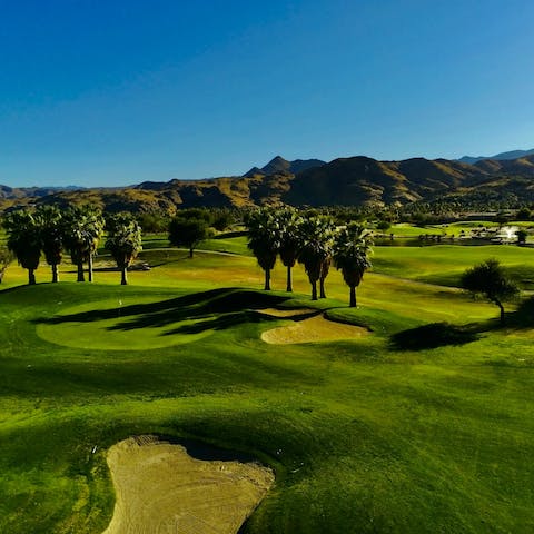 Tee off from one of Coachella Valley's multitude of golf courses that lie close to the home