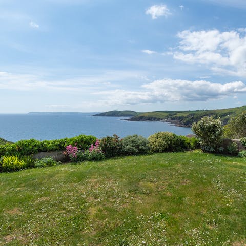Admire the views of the sea and Readymoney Cove from the garden