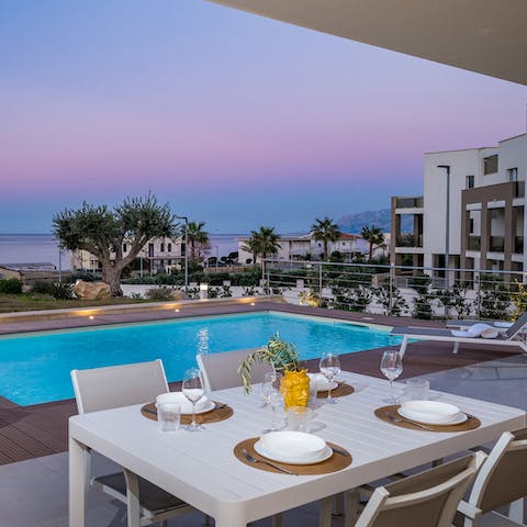 Enjoy an evening dinner alfresco mood-lit by one of Sicily's colourful sunsets