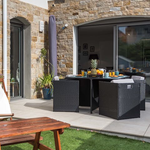 Enjoy breakfast on the sun-dappled patio area