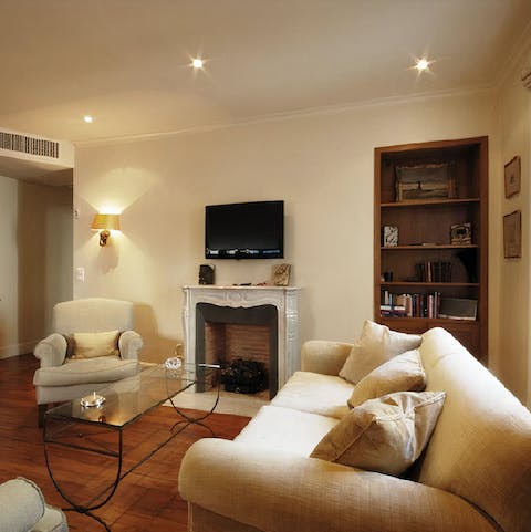 Gather around the ornate fireplace in the evening to unwind