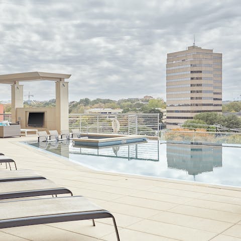 Chill out by the communal pool while catching some Texas rays