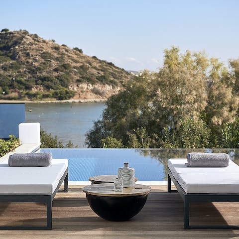 Rest on a lounger while admiring the sea views, before taking a dip in the private pool
