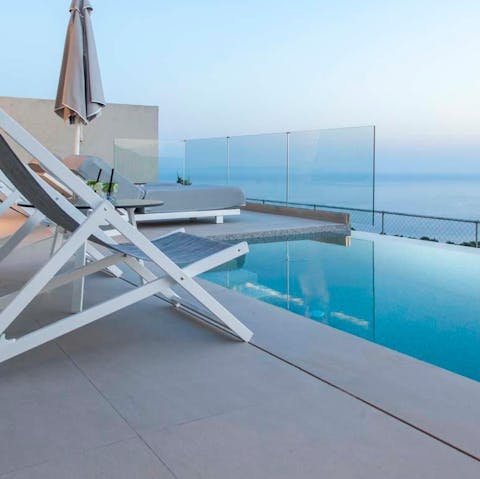 Spend your days dipping in and out of the private pool overlooking the blue Ionian Sea