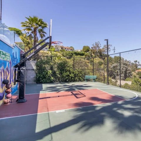 Shoot some hoops on the private basketball half-court