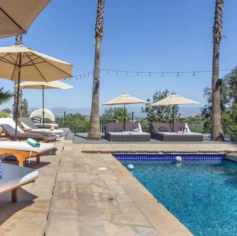 Soak up the sun after a swim in the private saltwater pool
