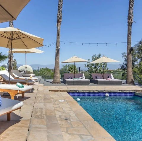 Soak up the sun after a swim in the private saltwater pool