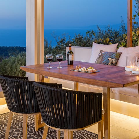 Sit down to an alfresco meal with views over the Ionian Sea
