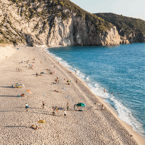 Spend an afternoon at Pefkoulia Beach, a five-minute drive away