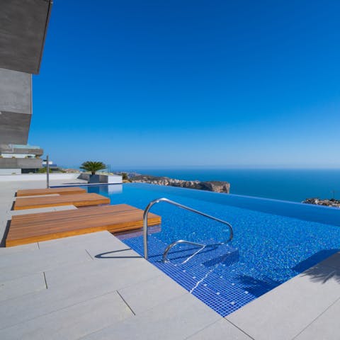Take a refreshing dip in the pool while soaking up infinite blue views 