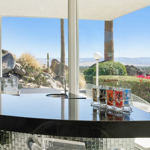 Enjoy a drink at the bar while gazing out at the San Jacinto mountains 