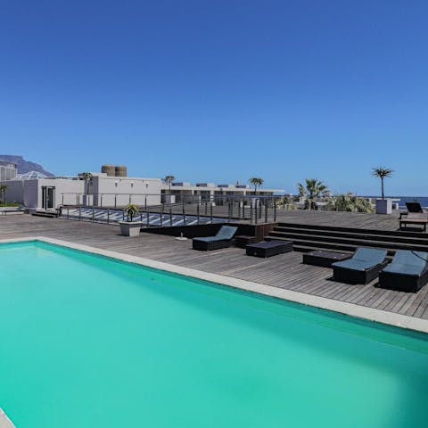 Relax and soak up the sun by the communal pool 