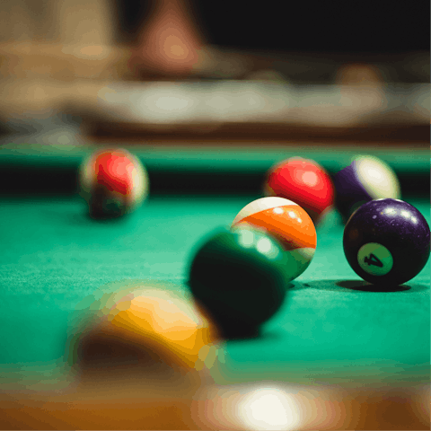 Start a tournament on the home's full-size billiards table