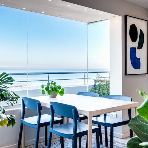 Look out to sea views over lunch at the dining table