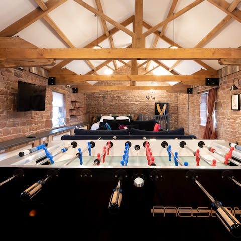 Get competitive on the home's foosball table