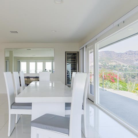 Serve dinner on the elegant white dining table and fight over who faces the window