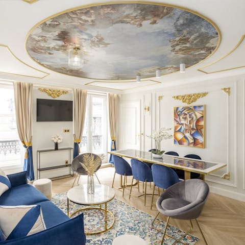 Admire the ceiling art in the living room