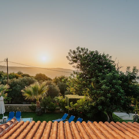 Watch the sunset over the mountains and sea from the large balcony