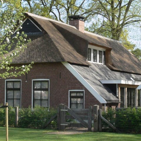 Stay in a fairytale-pretty Dutch farmhouse with a thatched roof