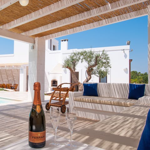 Enjoy a glass of sparkling wine in the outdoor lounge