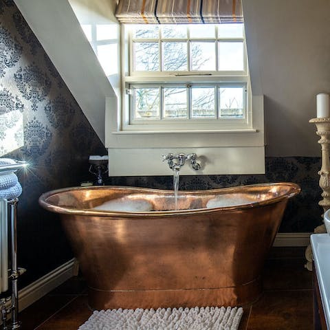 Soak in the copper bath after a busy day out exploring the Cotswolds